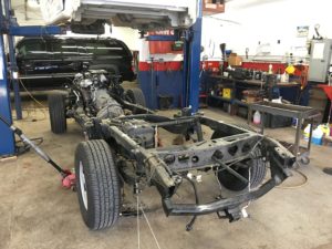 mechanic replaces truck frame